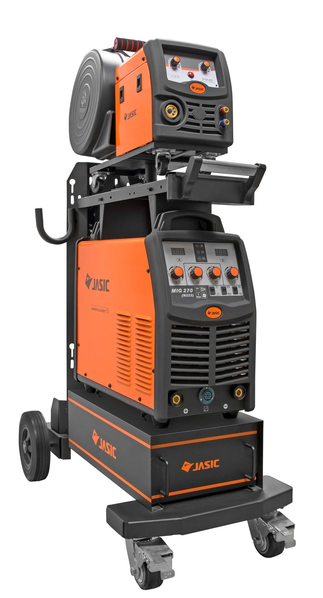 An industrial JASIC MIG 273L welding machine with control panels, cable reels, and storage compartments, mounted on a wheeled trolley for mobility.