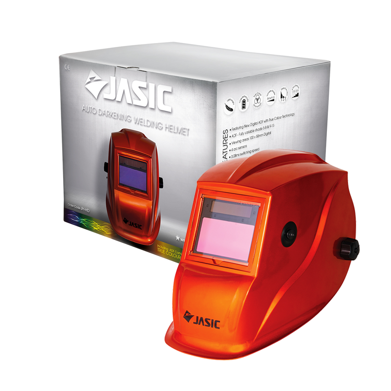 A bright orange Jasic auto-darkening welding helmet is shown next to its silver packaging box. Both items feature the Jasic logo.