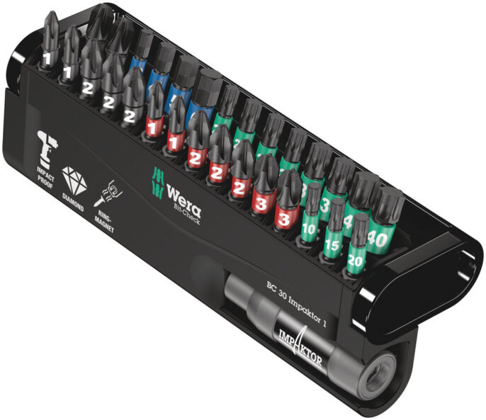A black plastic case holds assorted screwdriver bits and two sockets, each bit labelled with a number and colour-coded for size and type. The case displays the Wera logo.