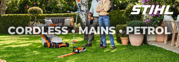 stihl_middle_banner Two people stand in a garden with STIHL lawn care equipment, including a lawnmower and strimmer, surrounded by greenery and flowers.