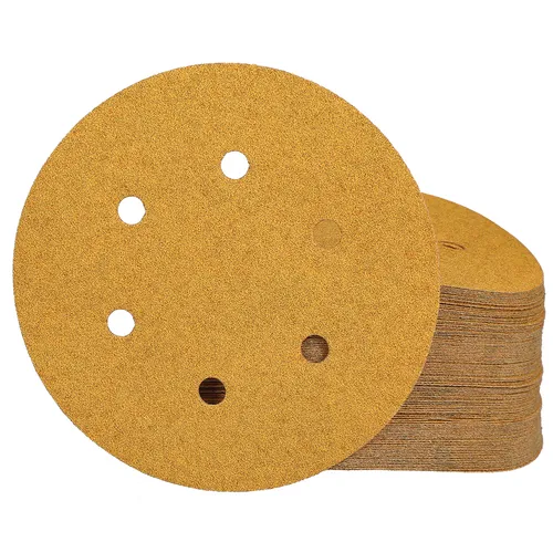 A stack of Mirka Gold 150mm PSA Sanding Discs with 6 holes per disc (100 pieces), designed for use with orbital sanders.