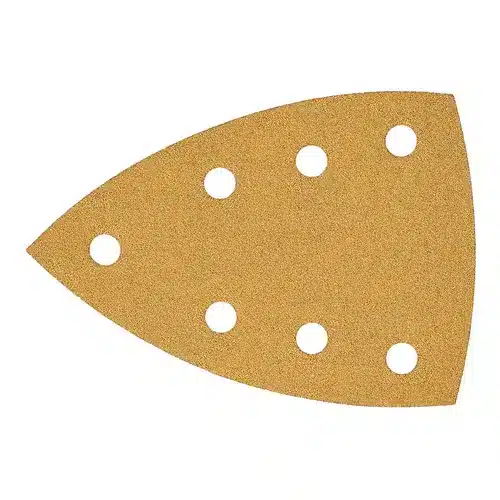 A light brown Mirka Gold sandpaper sheet, measuring 100x152x152mm, features a triangular shape with a pointed tip and seven evenly spaced round holes in a Grip 7 Holes pattern, designed for use with detail sanders.