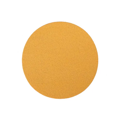 A round, flat, golden-yellow disc resembling a sheet of sandpaper is centred on a white background.