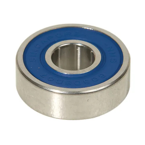 A metal ball bearing with a blue seal around the centre hole.