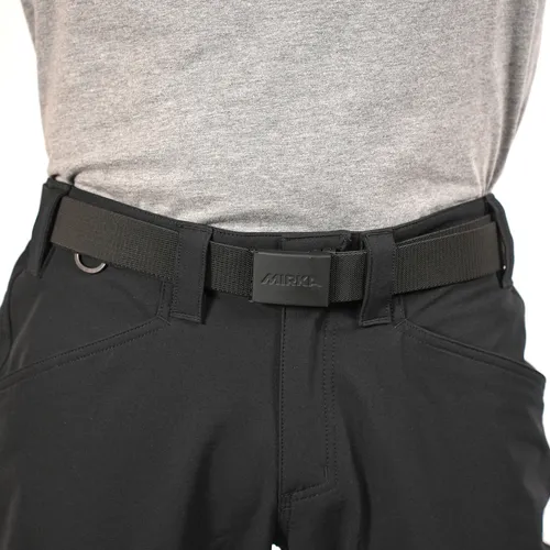 A person dressed in black trousers with a black tactical belt and a grey shirt. The image centres on the waist area, emphasising the belt’s clasp and loops.