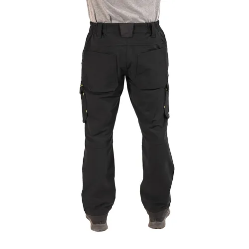 A person wearing black Mirka® Work Trousers Signature and a grey shirt, photographed from the back. The trousers have multiple pockets, and the individual is standing on a white background.