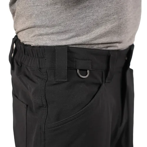 A person wearing a grey shirt and black work trousers that feature an elastic waistband, belt loops, pockets, and a small metal D-ring near the pocket.