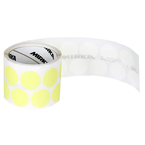 A roll of white adhesive tape features evenly spaced, pale yellow circular stickers that are Mirka Polestar 32mm PSA Sanding Discs (100pcs). Several sanding discs are visible on the extended portion of tape, and the roll carries a brand label.