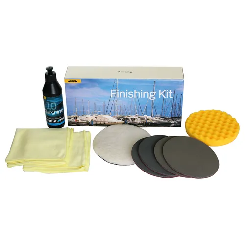 A finishing kit with polishing pads, yellow cloths, a round yellow sponge, a bottle, and a box featuring a marina scene.