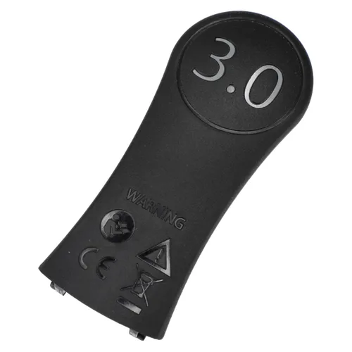 Black plastic key fob or battery cover with warning symbols and CE certification marks embossed on the lower half.