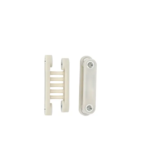 Two views of a small, beige plastic connector piece with metal screws, one displaying the side with multiple slots and the other displaying the flat top.