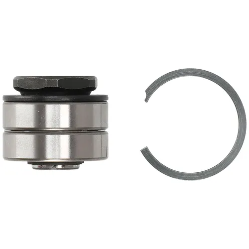 A metal bearing assembly with a hexagonal top sits beside a circular retaining ring on a white background.
