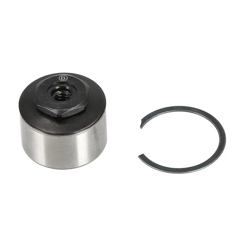 A round metal mechanical part topped with a black hexagonal nut is placed beside a thin black circlip on a white background.