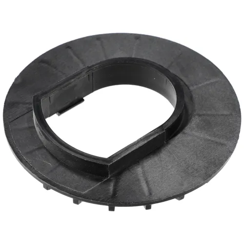 Black circular plastic component with a raised, irregularly shaped inner ring and small notches along the bottom edge, possibly an automotive or mechanical part.