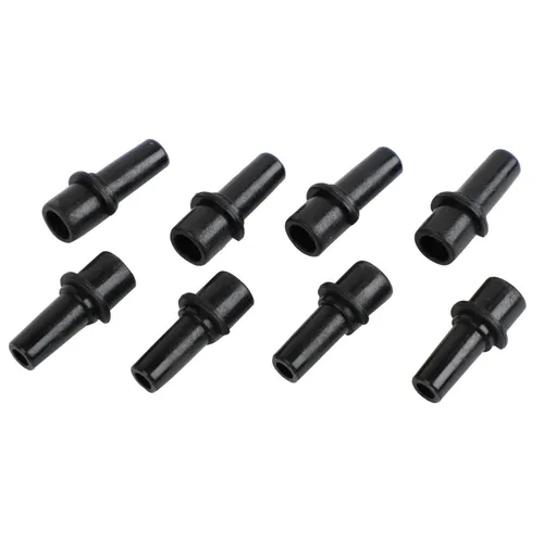 Eight small black plastic connectors with narrow cylindrical shapes and central ridges, arranged in two loose rows on a white background.