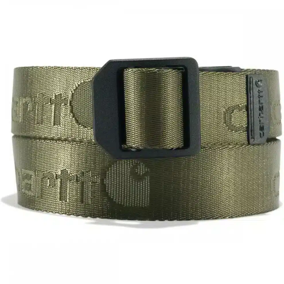 A rolled Carhartt Nylon Webbing Ladder Lock Belt in army green, featuring a black rectangular metal buckle and textured logo details on the fabric.