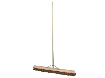 The Faithfull Broom Soft Coco 900mm (36in) + Handle & Stay features a long wooden handle and stay, and a rectangular head with soft brown coco bristles, making it perfect for sweeping large floor areas efficiently.