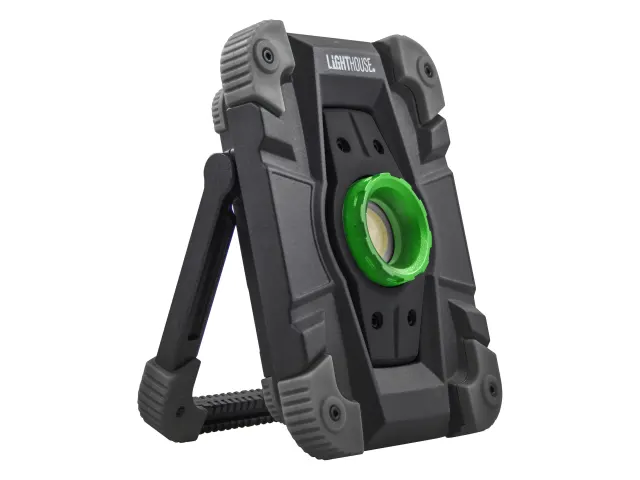 A rugged, black and grey portable work light with a green circular centre and a built-in stand.