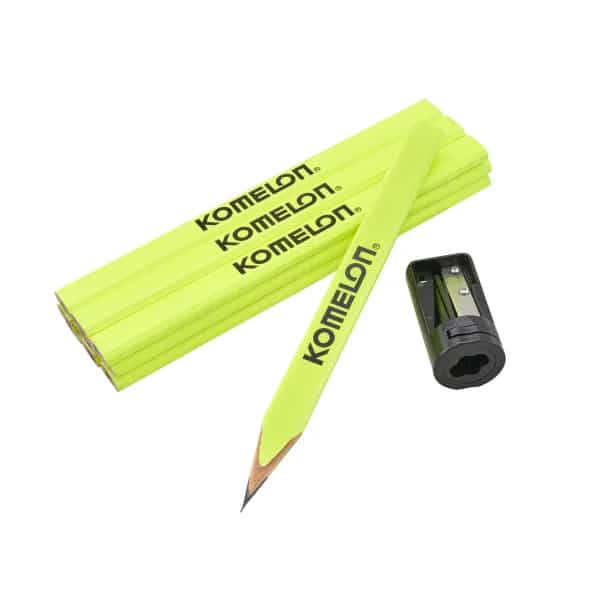 Three yellow carpenter pencils, one sharpened, with a black sharpener beside them on a white background.