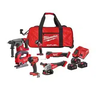 Milwaukee M18FPP6L3-503B 18v 6pc Fuel Power Pack including a rotary hammer, jigsaw, impact driver, multi-tool, and angle grinder, displayed with three 18v batteries, a charger, and a red tool bag.