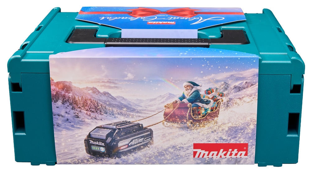 Teal Makita plastic carrying case wrapped in a festive sleeve featuring Father Christmas in a sleigh pulled by a power tool battery across a snowy mountain landscape.