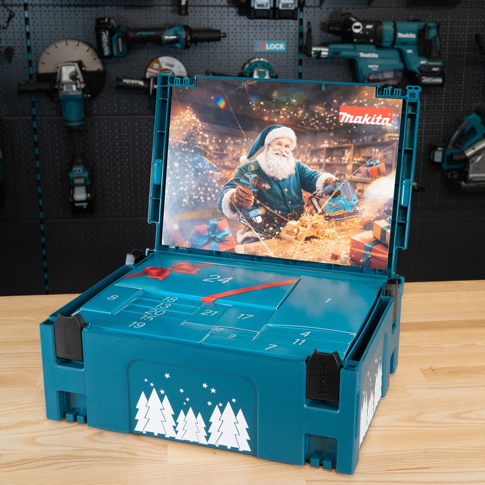 An open teal Makita Advent Calendar 2026 tool case with numbered compartments, featuring an interior panel showing Father Christmas using power tools.