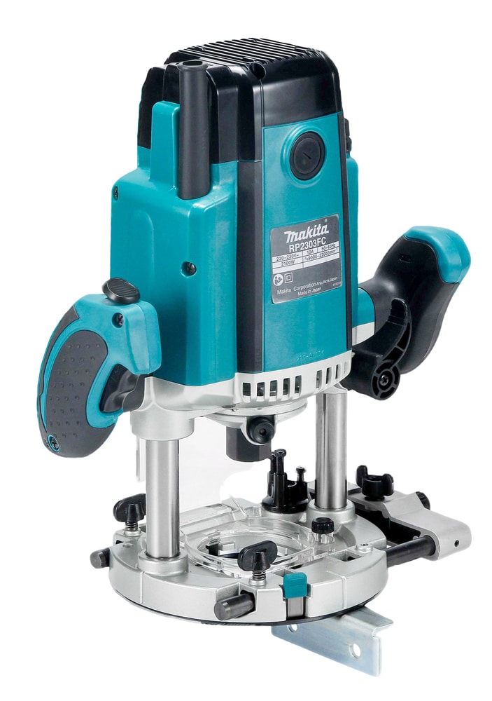 Makita RP2303FC08 1/2″ Plunge Router in teal and black, featuring two ergonomic handles, a clear base plate, and adjustable depth stops.